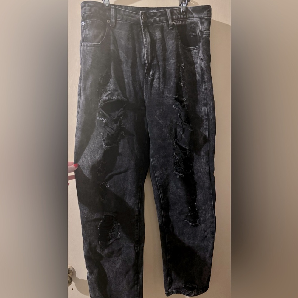 Baggy very ripped jeans.
